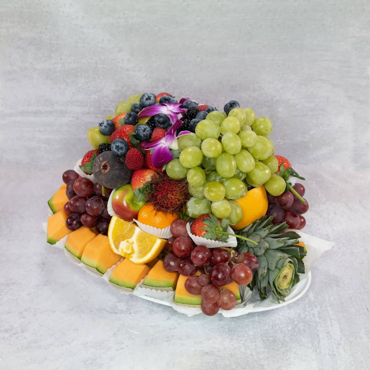 Large fruit platter party tray fresh cut pineapple melons grapes strawberries