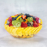 Ready to eat fruit bowl tropical fruits mango kiwi strawberries blueberries melon
