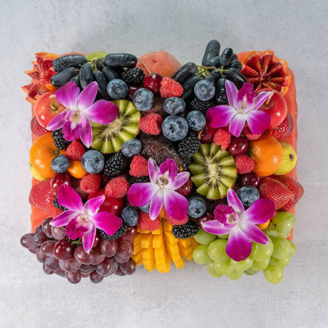 Half moon fruit platter ready to eat pineapple strawberries watermelon grapes berries